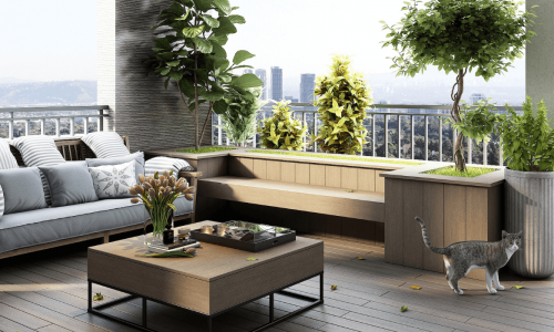 A modern apartment balcony with comfortable seating, plants, and a cat exploring the space.